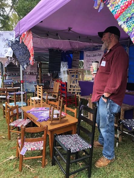 Kids' chairs and a little table with woven seats at the booth